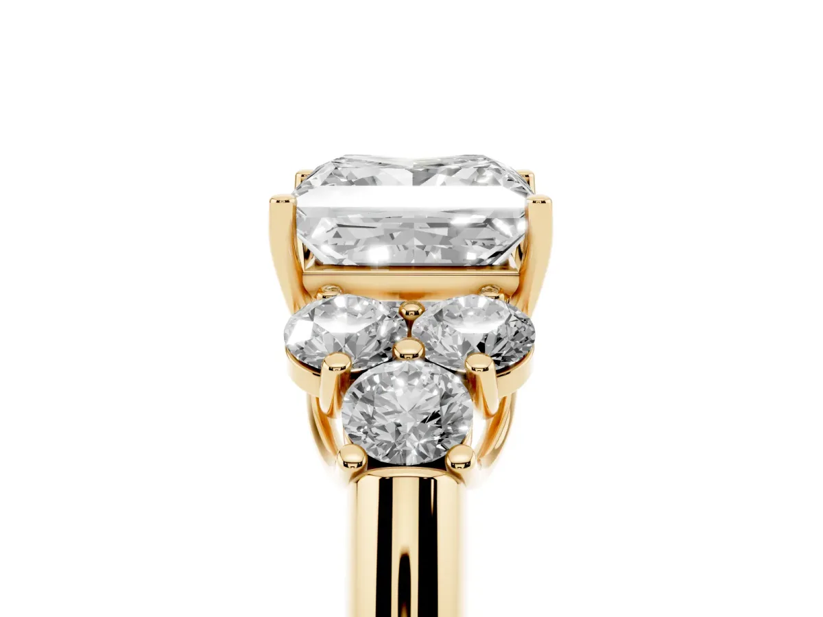 Princess Cut Cut Diamond Cluster Ring with Round Accent Stones and Prong Setting on a Classic Band Yellow gold