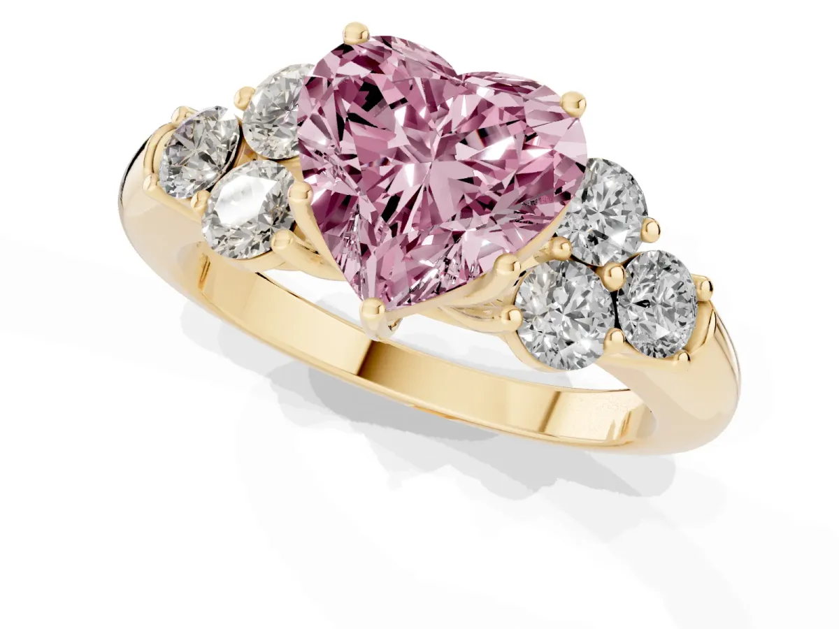 Fancy Pink Heart Cut Cut Diamond Cluster Ring with Round Accent Stones and Prong Setting on a Classic Band Yellow gold