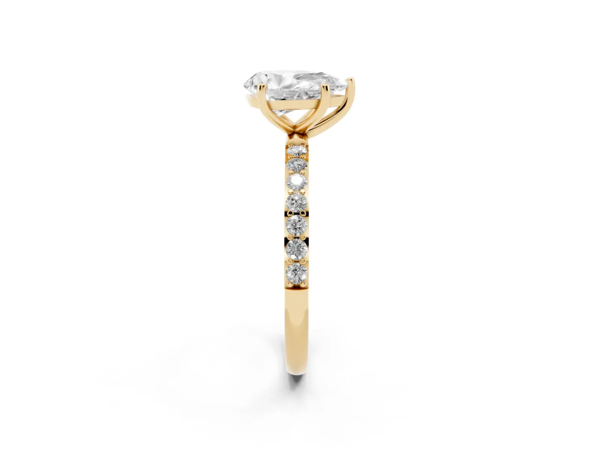 Pear Cut Diamond Solitaire Ring with Round Pavé Shoulders and Prong Setting Yellow gold