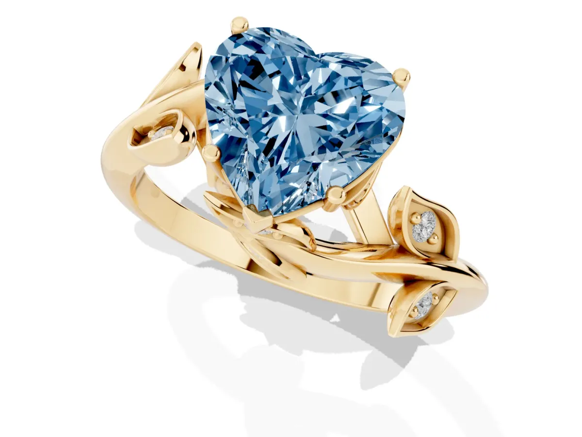 Fancy Blue Heart Cut Solitaire Twist Engagement Ring with Leaf Accents and Prong Setting Yellow gold
