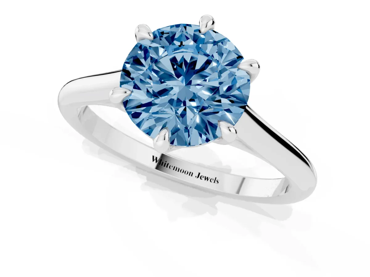 Fancy Blue Round Cut Solitaire Engagement Ring with Six-Prong Setting and Classic Band Silver