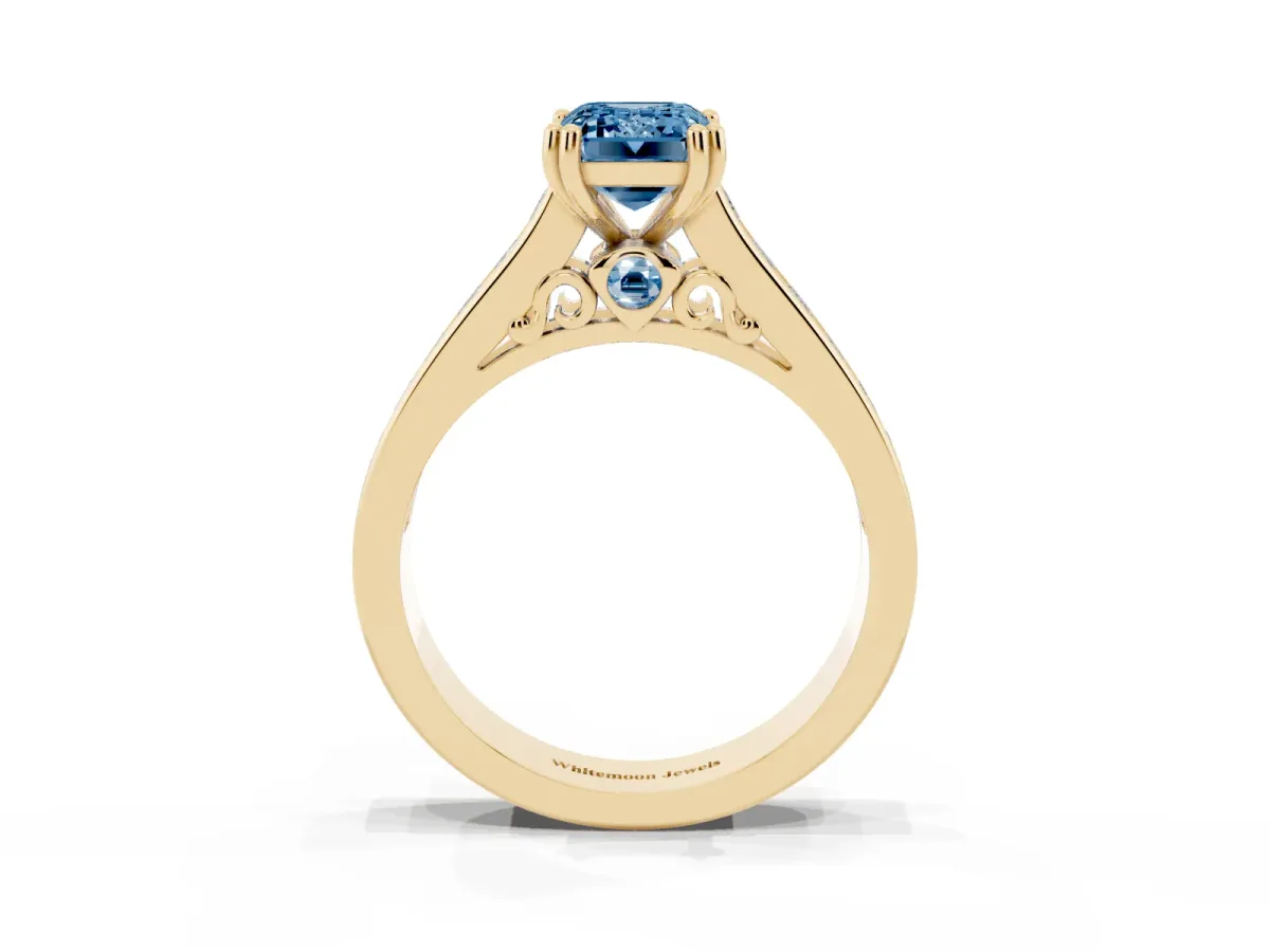 Fancy Blue Emerald Cut Cut Channel Set Solitaire Engagement Ring with Prong Setting Yellow gold