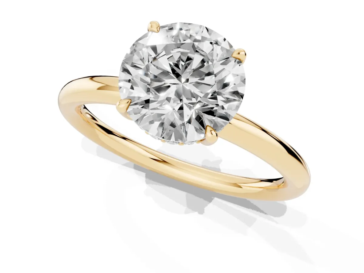 Round Cut Diamond Solitaire Ring with Thin Band and Four-Prong Setting Yellow gold
