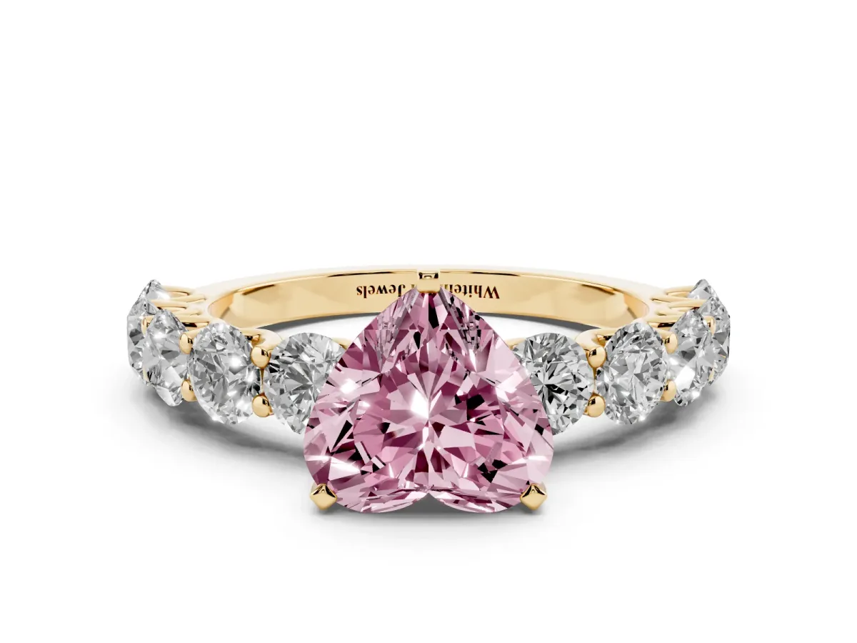 Fancy Pink Heart Cut Diamond Prong Setting with Side Stones on a Pave Band Yellow gold