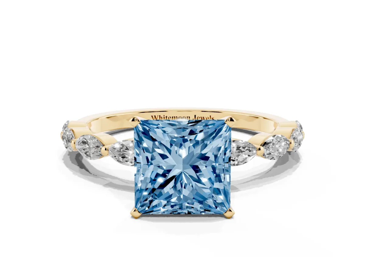 Fancy Blue Princess Cut Diamond Ring with Marquise Side Stones and Prong Setting Yellow gold