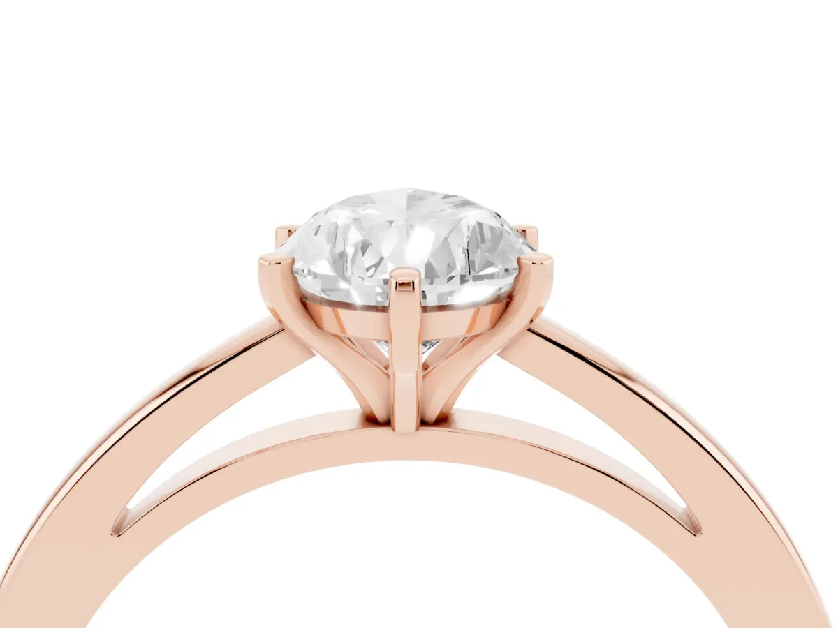 Pear Cut Solitaire Diamond Engagement Ring with Four-Prong Setting on a Classic Band Rose gold