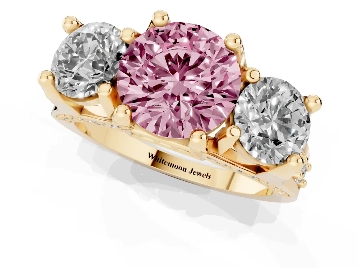 Fancy Pink Round Cut Diamond Three-Stone Ring with Channel Set Band and Four-Prong Setting Yellow gold
