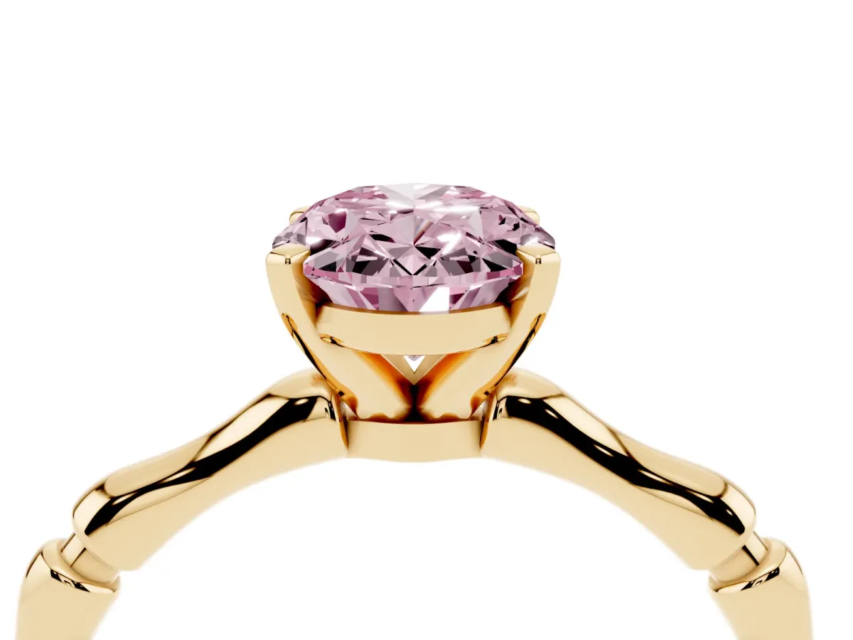 Fancy Pink Oval Cut Solitaire Diamond Ring with Bamboo Band and Four-Prong Setting Yellow gold