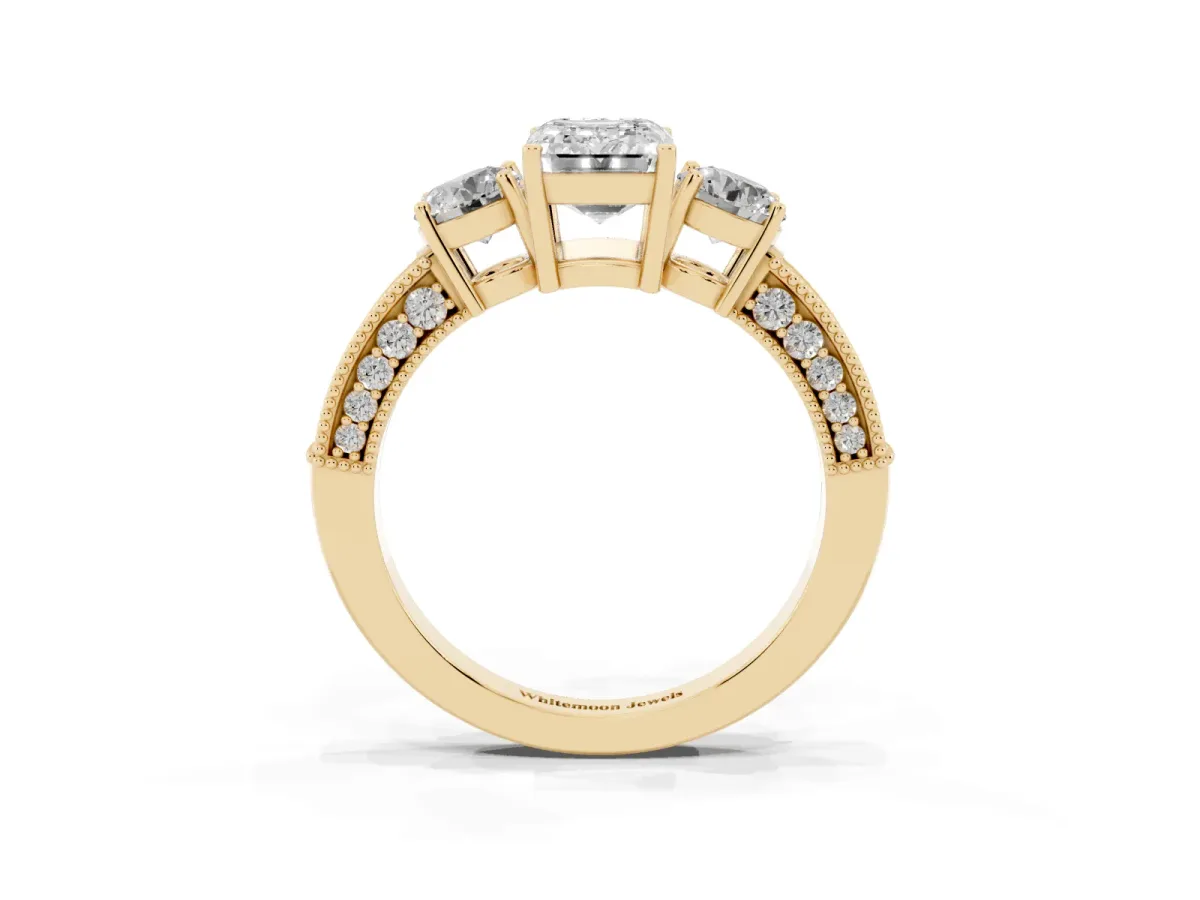 Emerald Cut Three-Stone Diamond Ring with Pavé Band and Four-Prong Setting Yellow gold