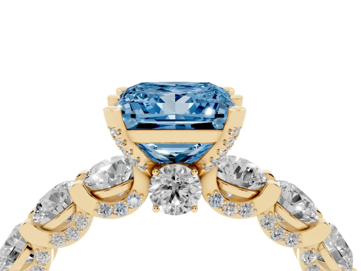 Fancy Blue Princess Cut Diamond Side Stone Engagement Ring with Four-Prong Setting Yellow gold