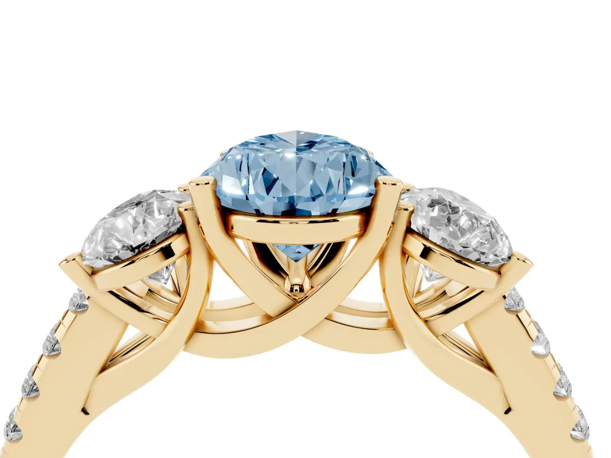 Fancy Blue Three-Stone Pear Cut Diamond Ring with Round Pavé Band and Prong Setting Yellow gold