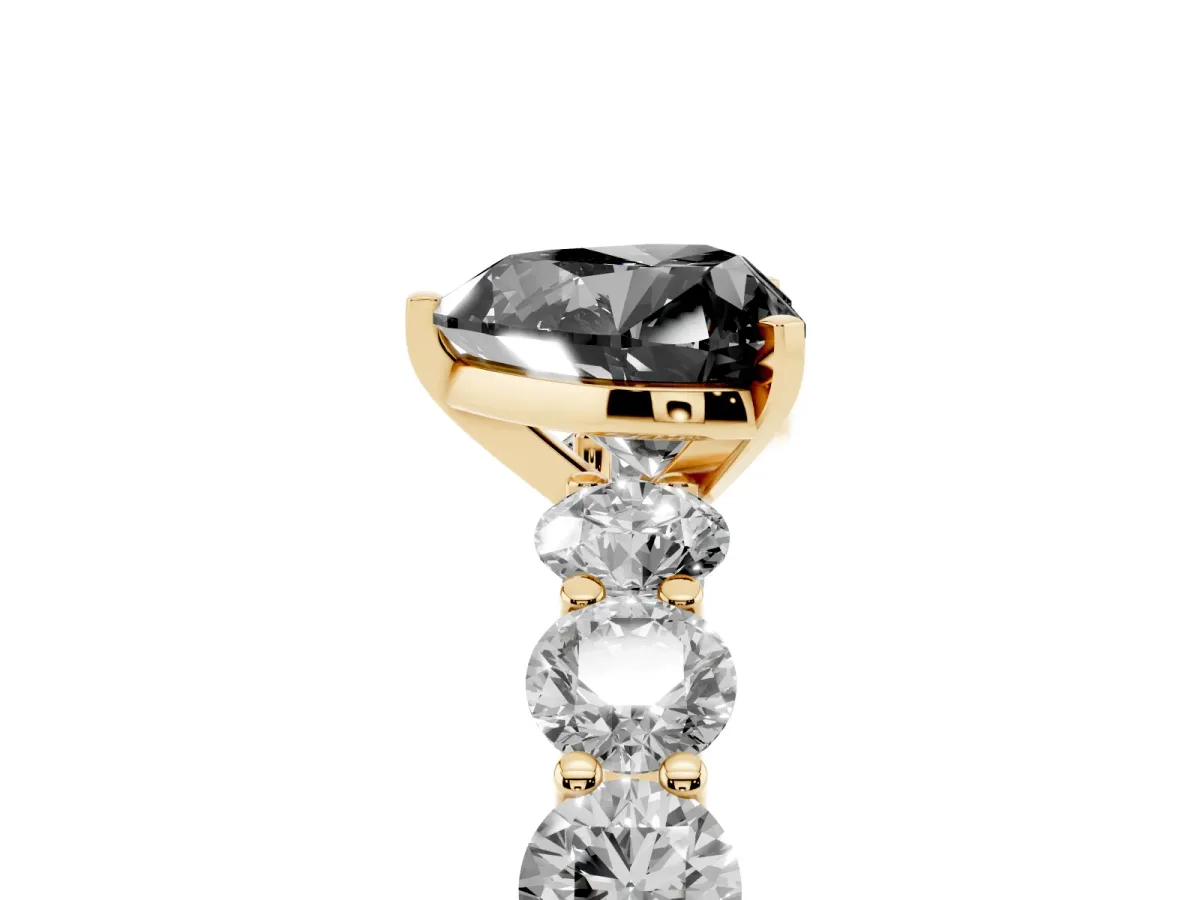 Fancy Black Heart Cut Diamond Prong Setting with Side Stones on a Pave Band Yellow gold