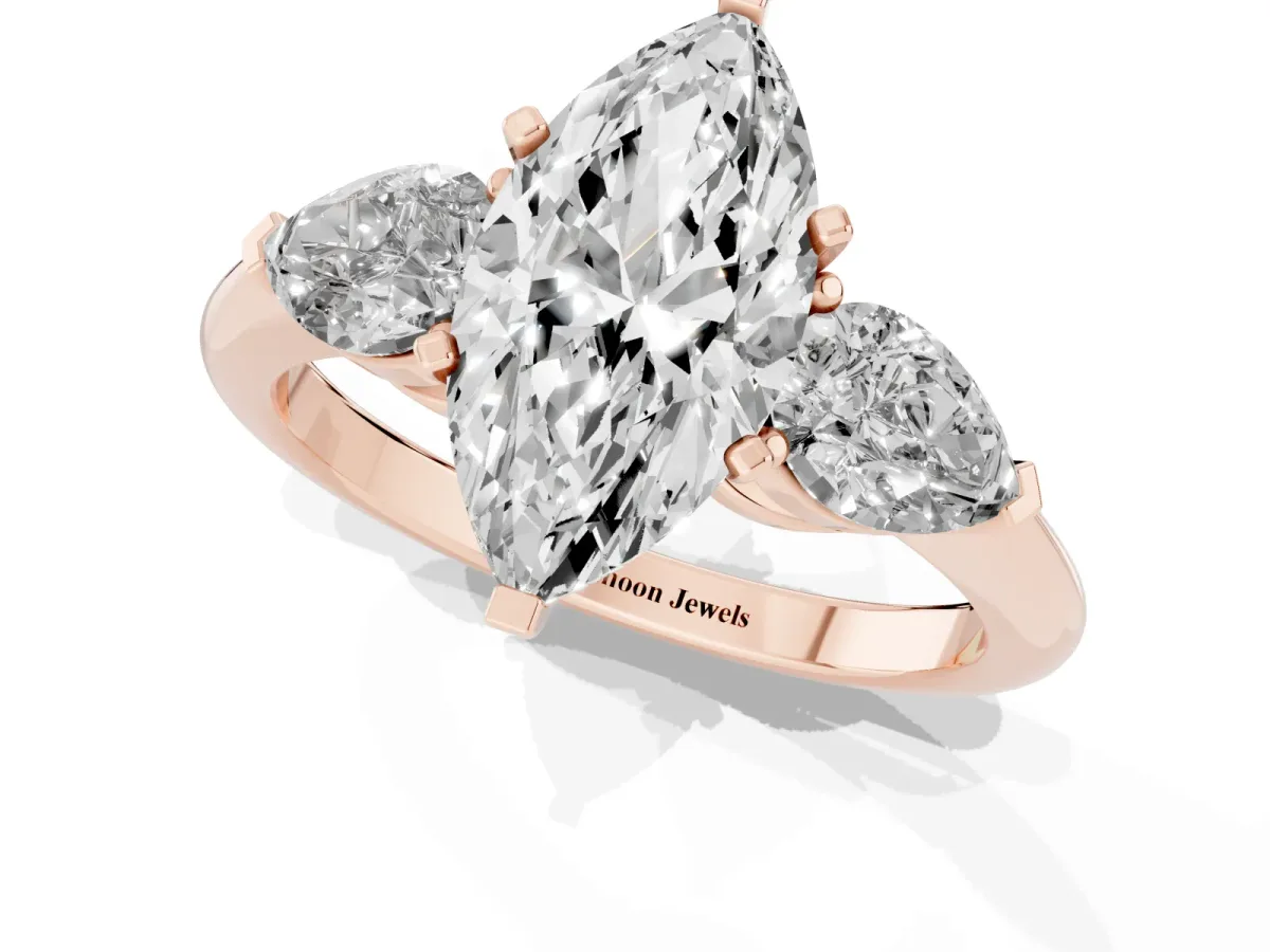 Three-Stone Marquise Cut Diamond Ring with Pear Side Stones and Four-Prong Setting Rose gold