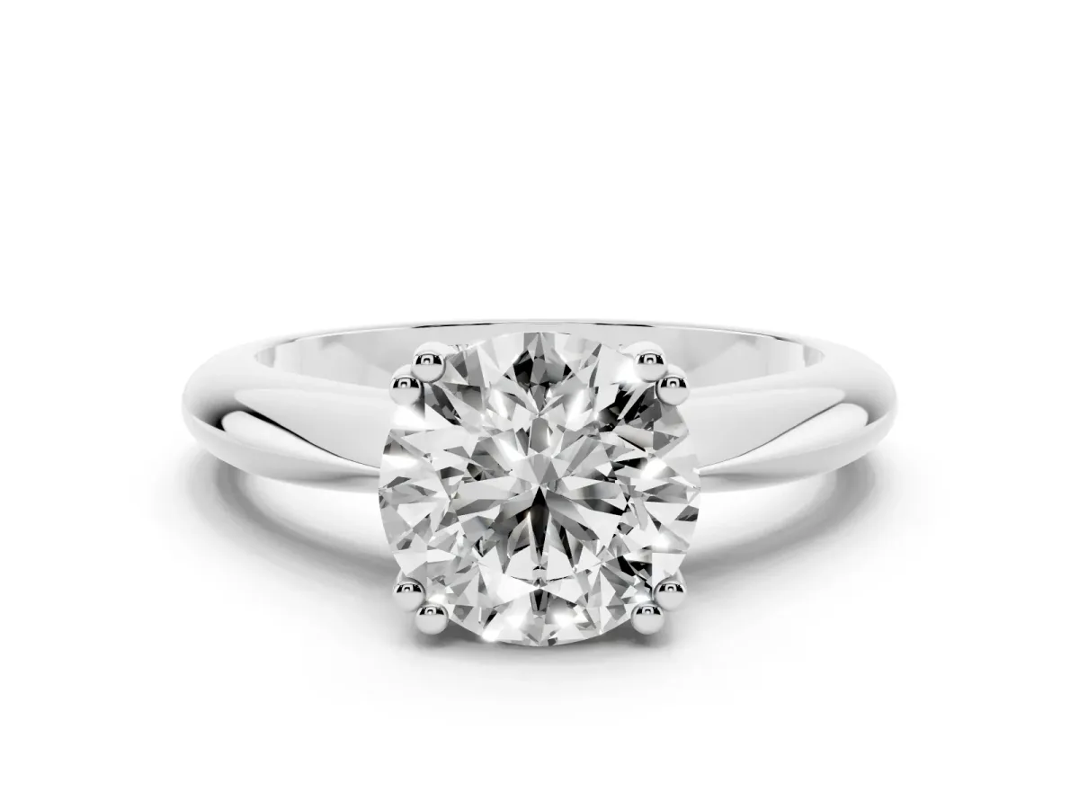 Round Cut Cut Solitaire Engagement Ring with Tapered Band and Four-Prong Setting Platinum