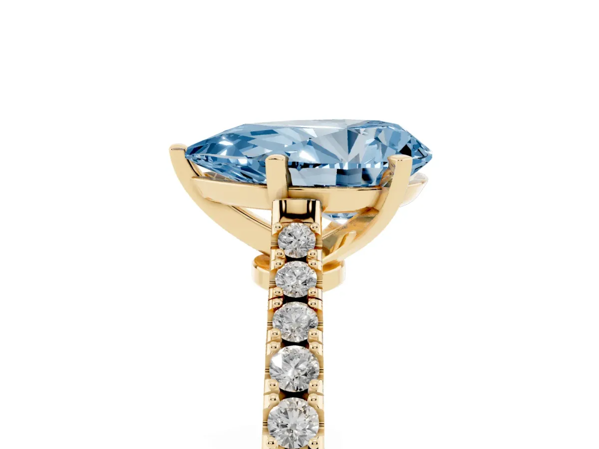 Fancy Blue Pear Cut Cut Solitaire Diamond Engagement Ring with Pave Band and Four-Prong Setting Yellow gold