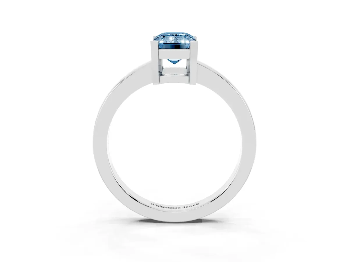 Fancy Blue Emerald Cut Cut Solitaire Ring with Four-Prong Setting and Classic Band Silver