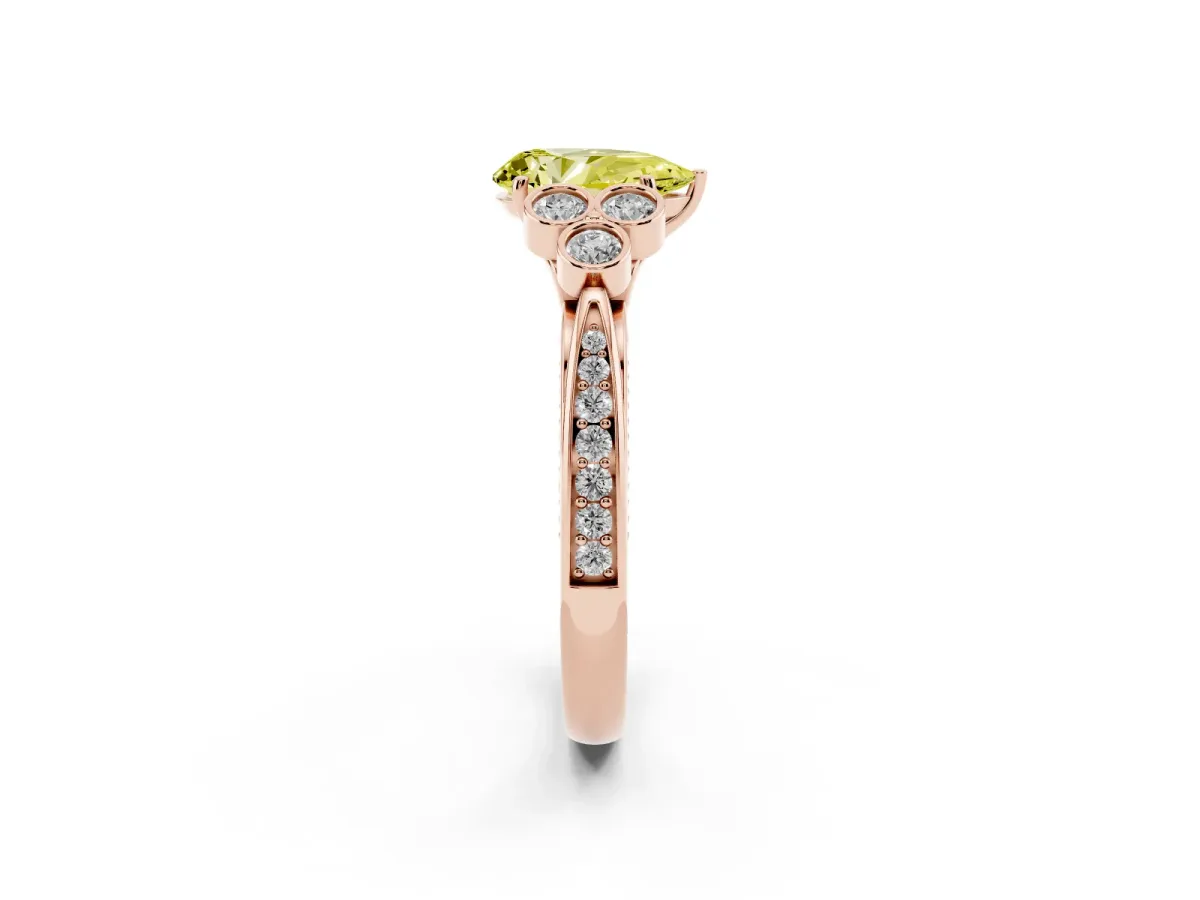 Fancy Yellow Pear Cut Cut Diamond Engagement Ring with Bezel Set Round Side Stones and Prong Setting Rose gold
