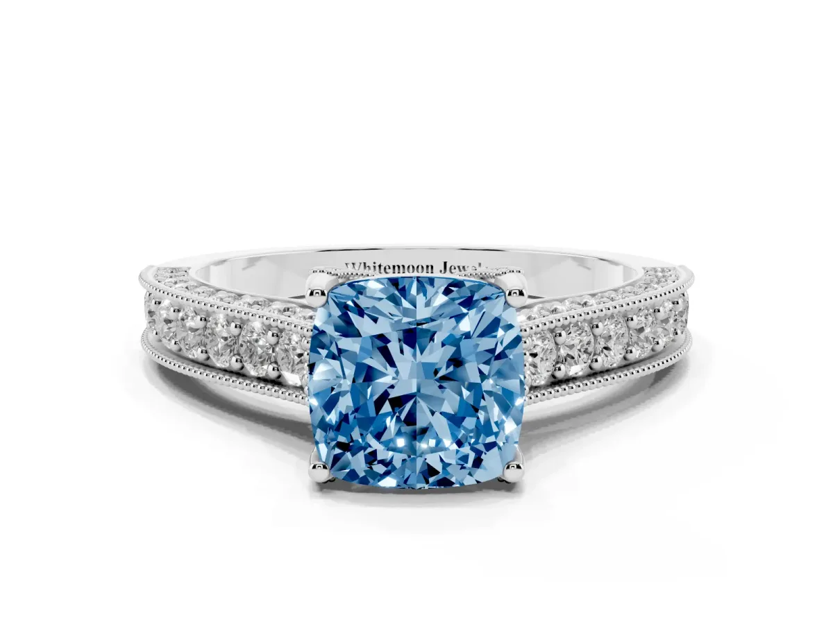 Fancy Blue Cushion Cut Cut Diamond Solitaire Ring with Milgrain Pave Band and Four Prong Setting Silver