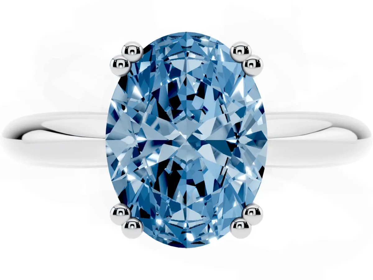 Fancy Blue Oval Cut Cut Solitaire Engagement Ring with Tapered Band and Four-Prong Setting Silver