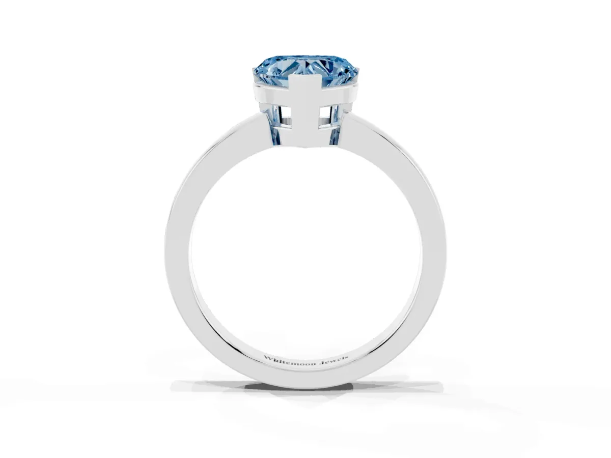 Fancy Blue Heart Cut Cut Solitaire Ring with Four-Prong Setting and Classic Band Silver