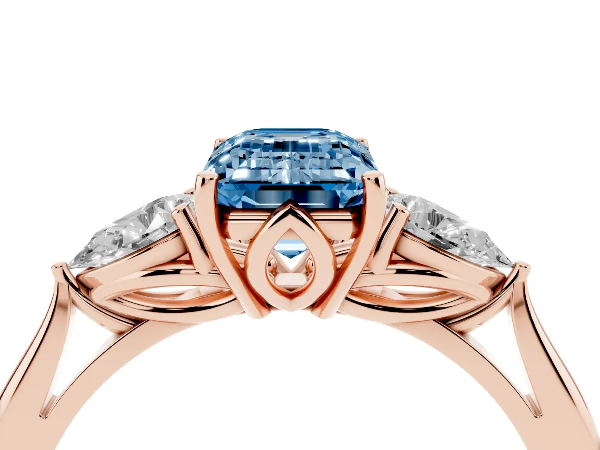 Fancy Blue Emerald Cut Diamond Three-Stone Ring with Pear Side Stones and Prong Setting Rose gold