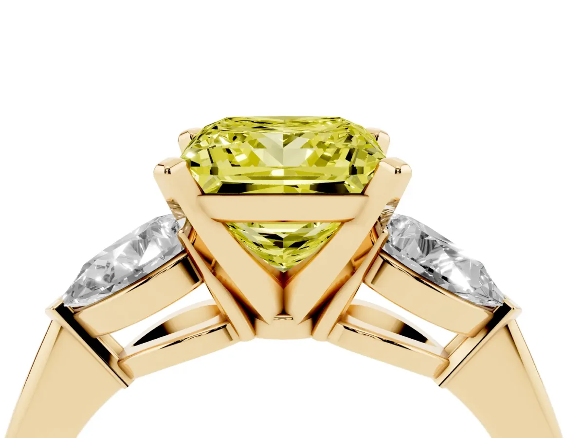 Fancy Yellow Three-Stone Princess Cut Diamond Ring with Pear Side Stones and Four-Prong Setting Yellow gold