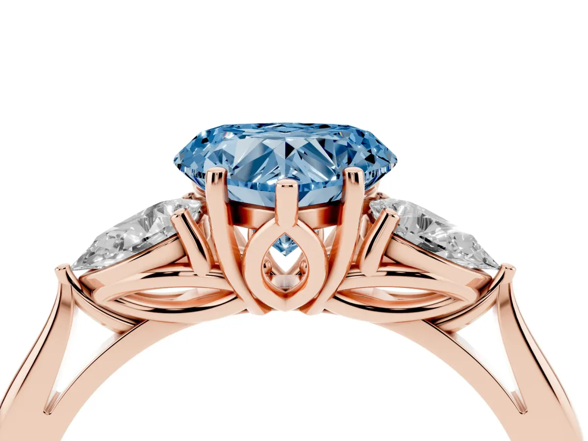 Fancy Blue Three-Stone Heart Cut Diamond Ring with Pear Side Stones in Four-Prong Setting Rose gold
