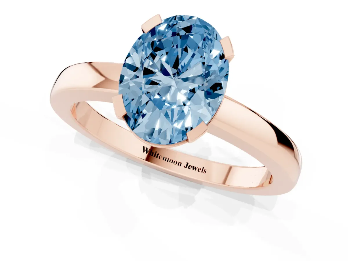 Fancy Blue Oval Cut Cut Solitaire Ring with Four-Prong Setting and Classic Band Rose gold