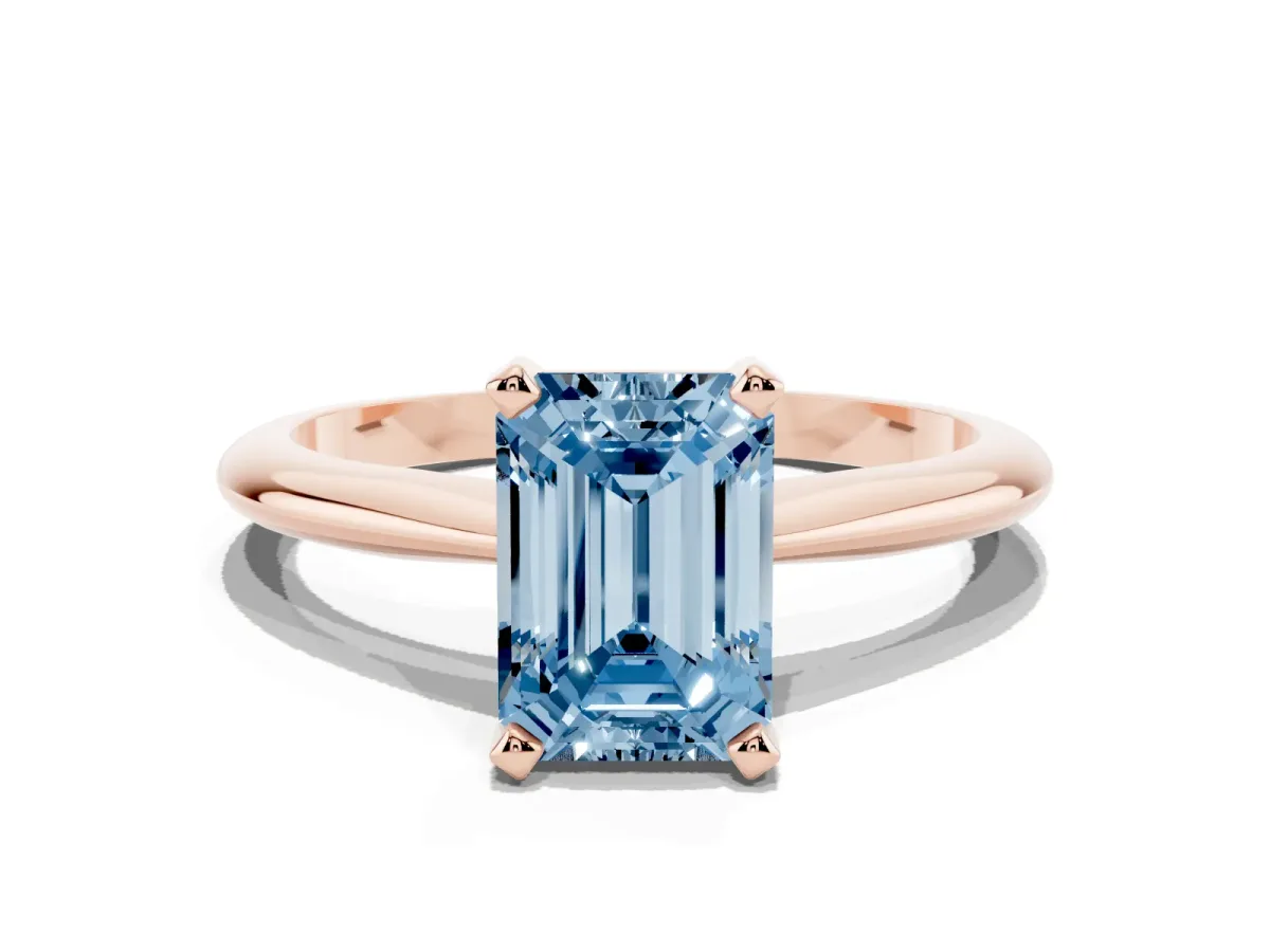 Fancy Blue Emerald Cut Cut Solitaire Ring with Four-Prong Setting on a Classic Band Rose gold