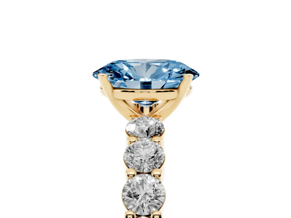 Fancy Blue Oval Cut Diamond Solitaire Ring with Shared Prong Round Side Stones Yellow gold