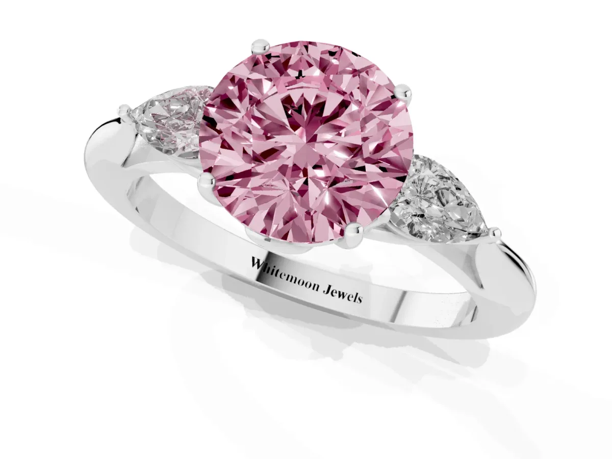 Fancy Pink Three-Stone Round Cut Diamond Ring with Pear Side Stones in Four-Prong Setting Platinum