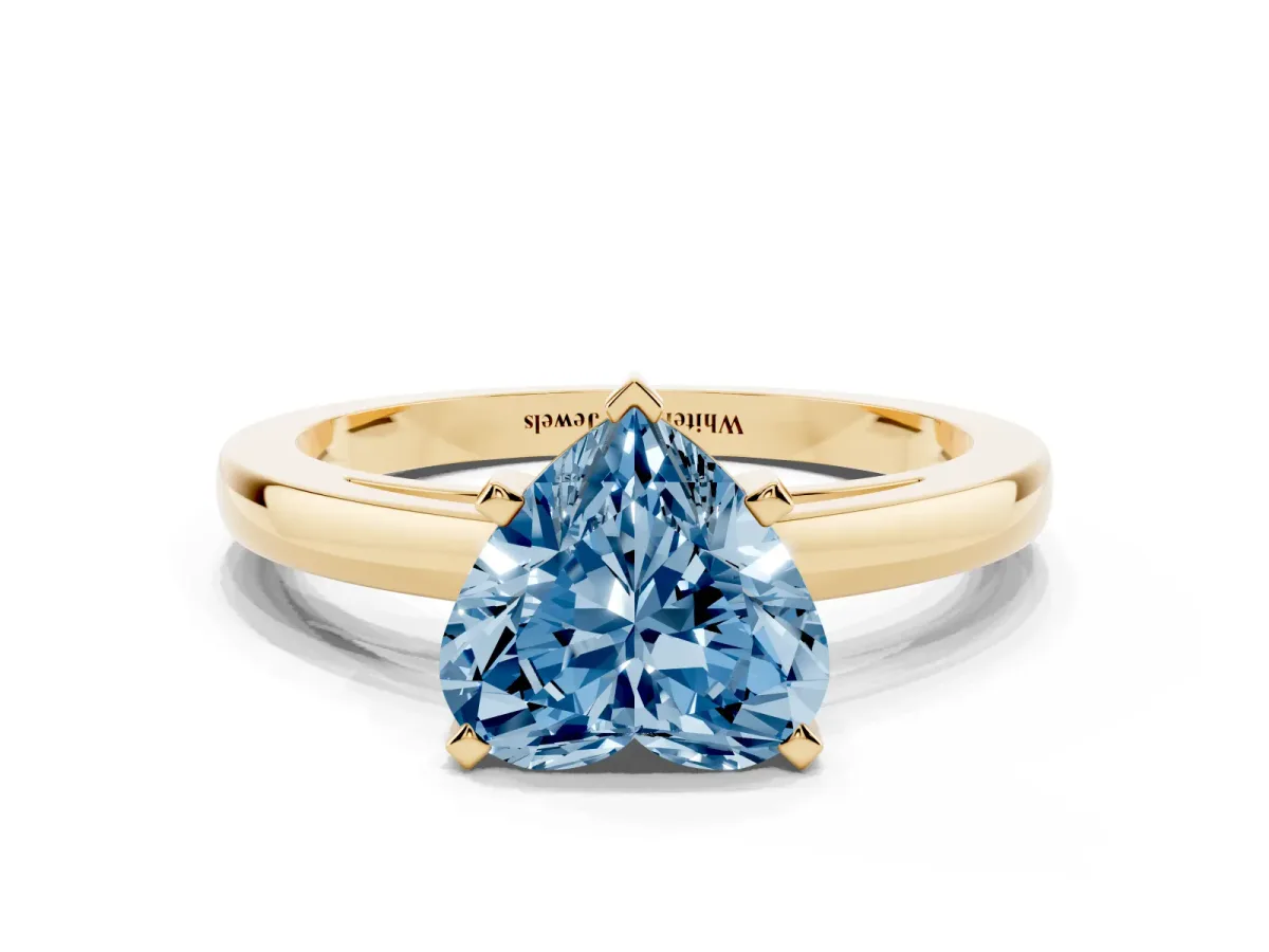 Fancy Blue Heart Cut Solitaire Diamond Engagement Ring with Four-Prong Setting on a Classic Band Yellow gold