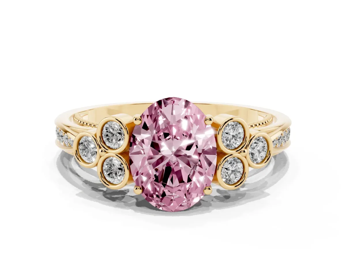 Fancy Pink Oval Cut Cut Diamond Engagement Ring with Bezel Set Round Side Stones and Prong Setting Yellow gold