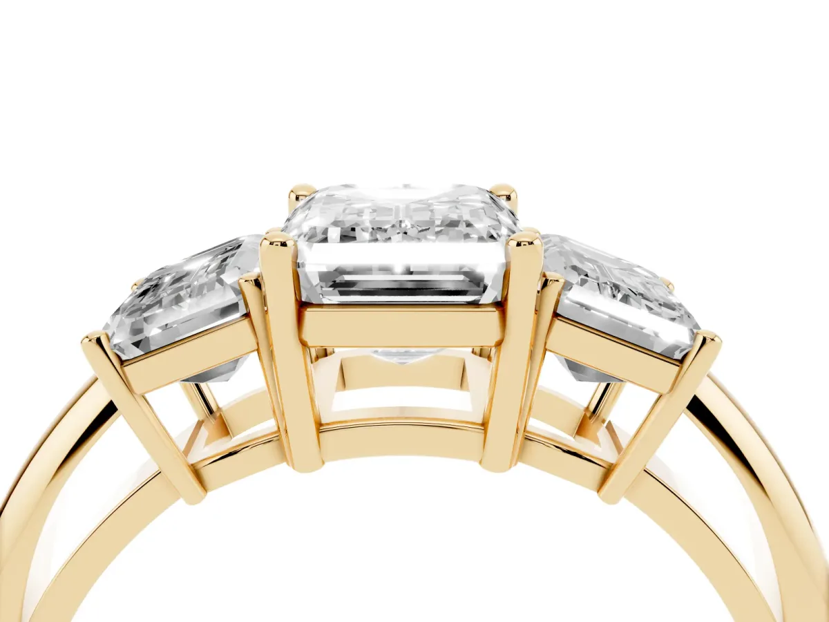 Three-Stone Emerald Cut Cut Diamond Engagement Ring with Prong Setting on a White Gold Band Yellow gold