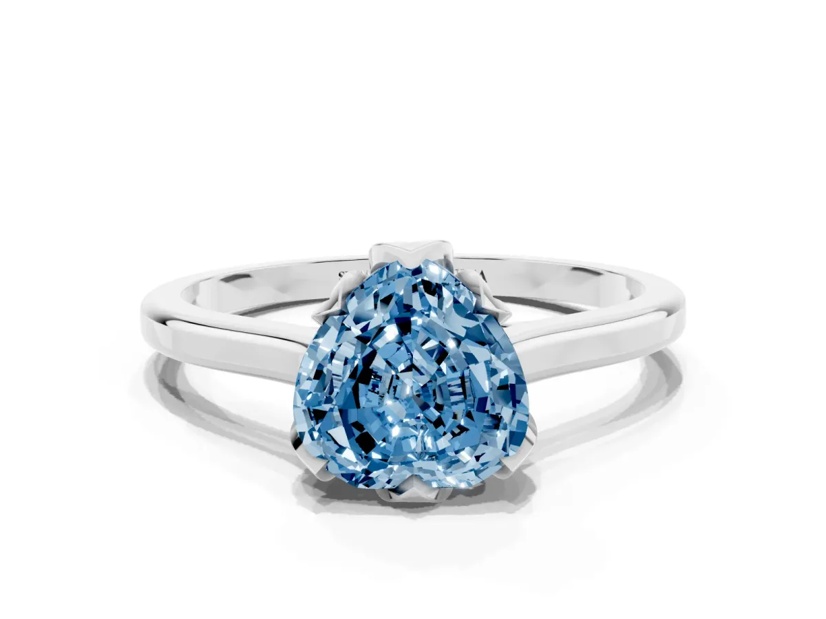 Fancy Blue Heart Cut Diamond Solitaire Ring with Flower Prong Setting and Classic Band Silver
