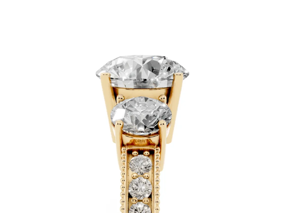 Round Cut Three-Stone Diamond Ring with Pavé Band and Four-Prong Setting Yellow gold