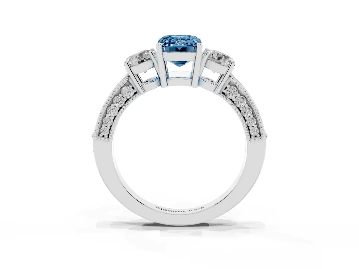 Fancy Blue Emerald Cut Three-Stone Diamond Ring with Pavé Band and Four-Prong Setting Silver