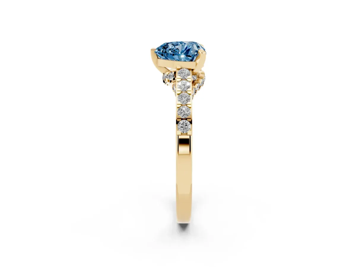 Fancy Blue Heart Cut Diamond Solitaire Ring with Crossover Gallery and Round Pavé Band Yellow gold