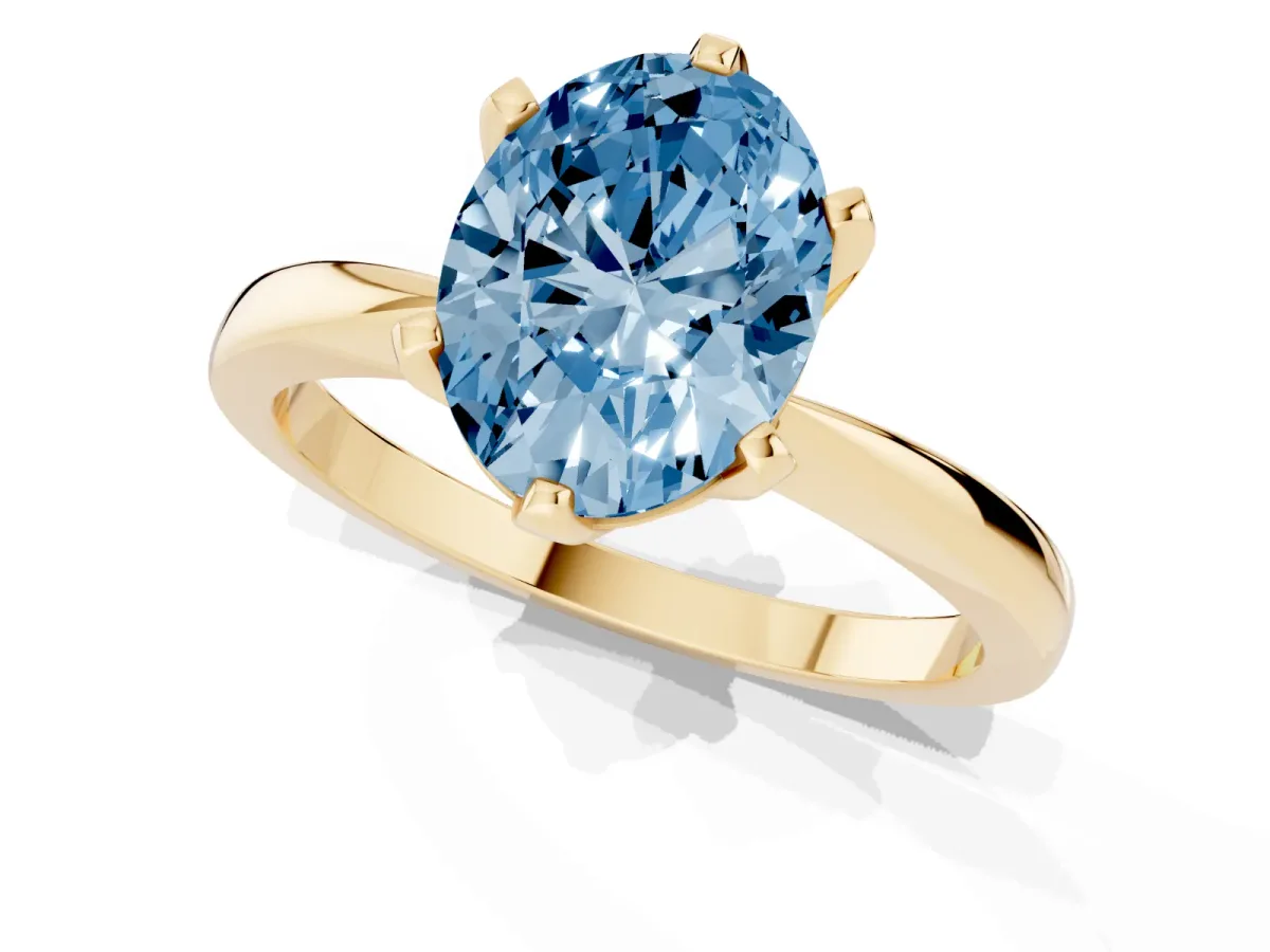 Fancy Blue Oval Cut Solitaire Engagement Ring with Six-Prong Setting and Tapered Band Yellow gold