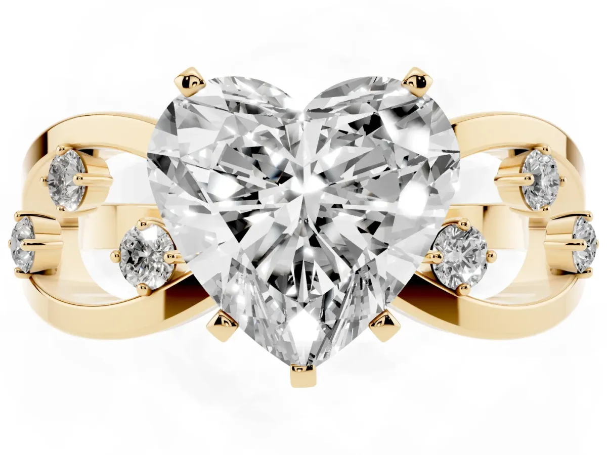 Heart Cut Cut Solitaire Diamond with Side Stones on Criss-Cross Band and Four-Prong Setting Yellow gold