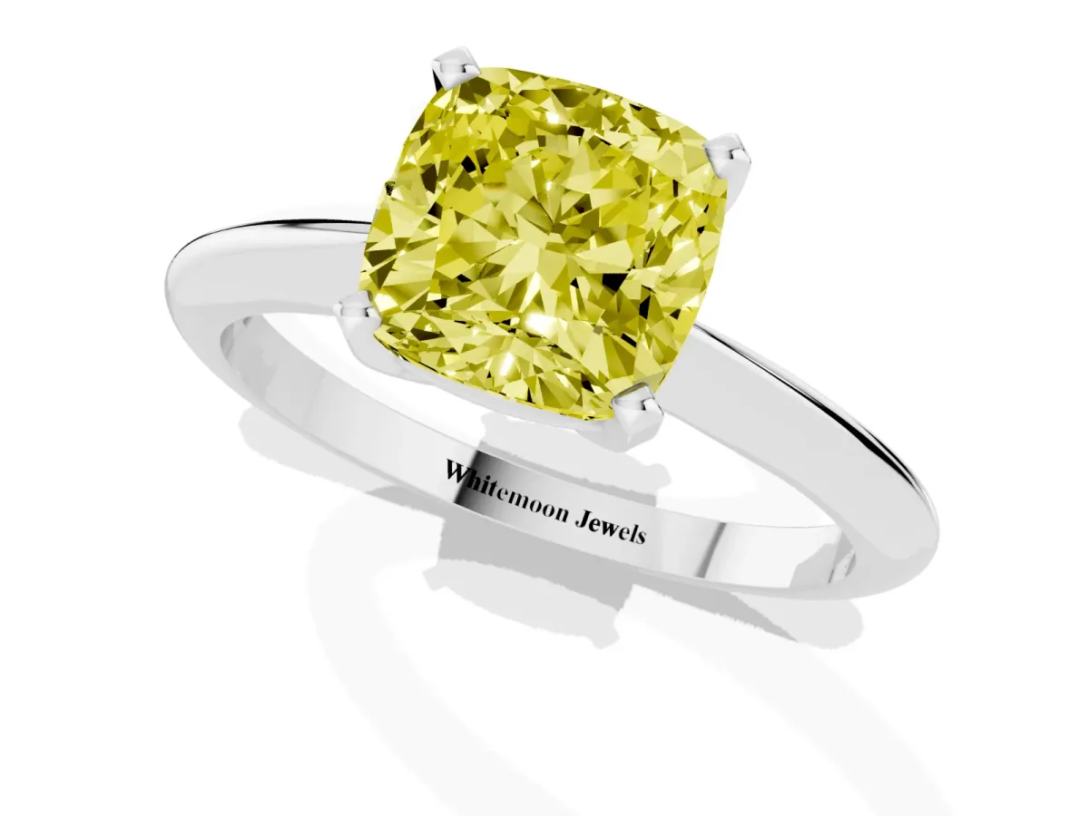 Fancy Yellow Cushion Cut Cut Solitaire Ring with Four-Prong Setting on a Classic Band Silver