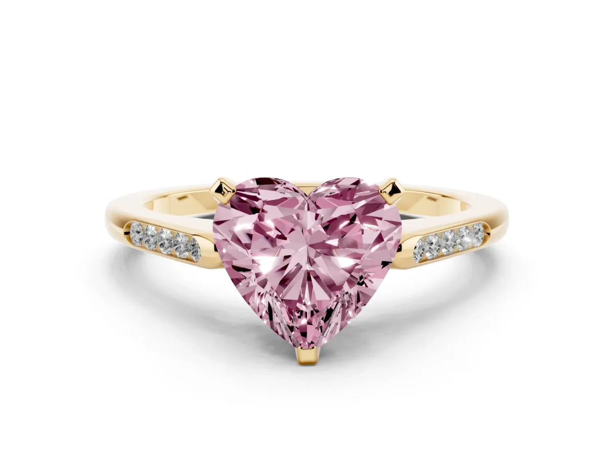 Fancy Pink Heart Cut Diamond Solitaire Ring with Channel Set Round Band and Prong Setting Yellow gold