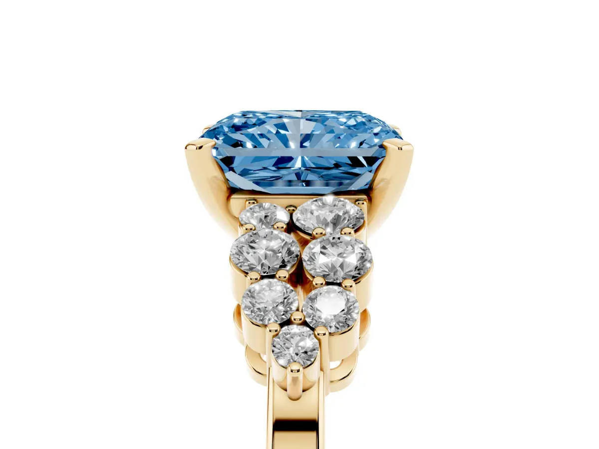 Fancy Blue Radiant Cut Cluster Diamond Engagement Ring with Pavé Band and Four-Prong Setting Yellow gold