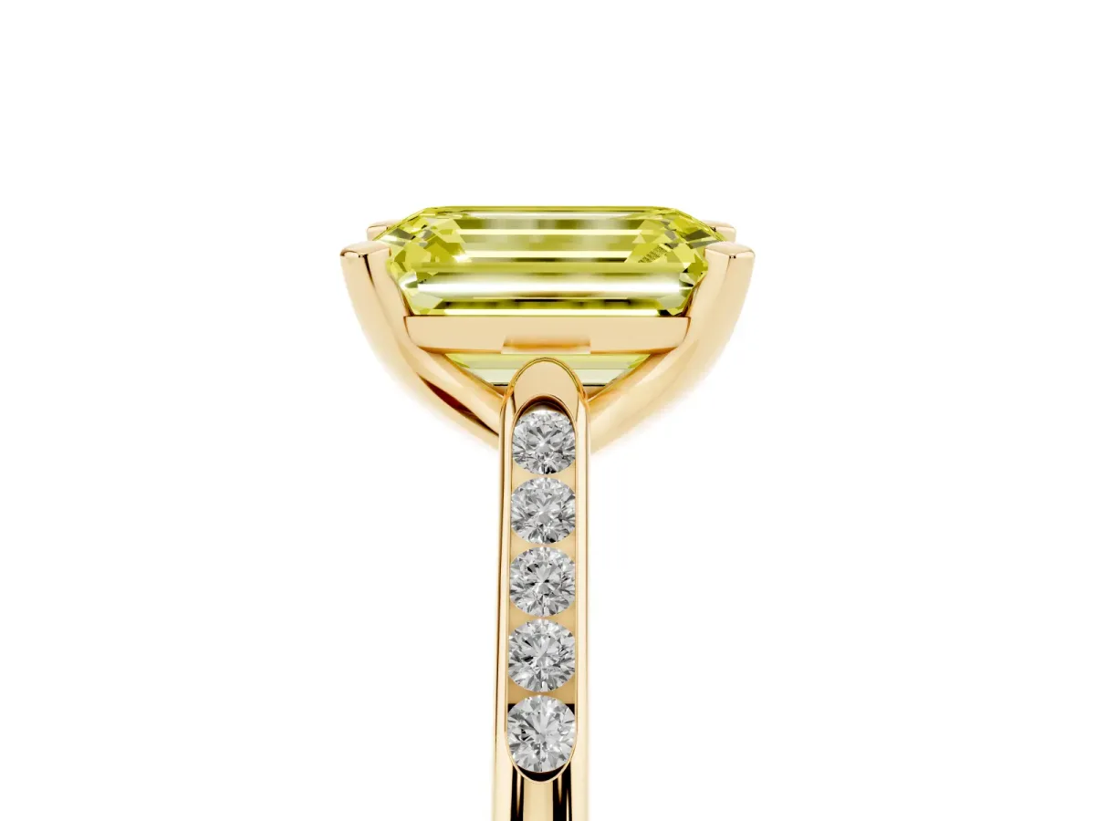 Fancy Yellow Emerald Cut Diamond Solitaire Ring with Channel Set Round Band and Prong Setting Yellow gold