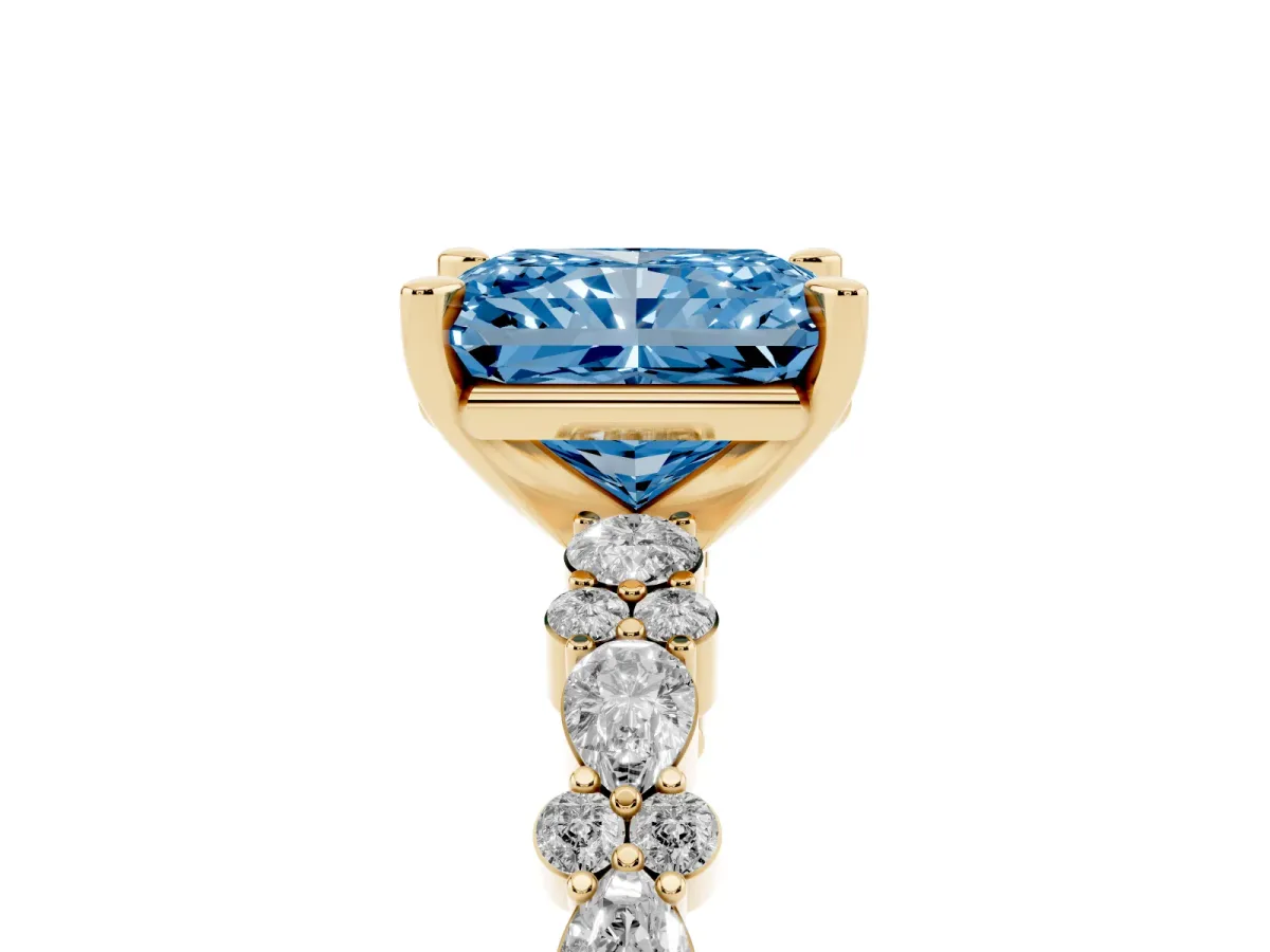 Fancy Blue Radiant Cut Diamond Side Stone Solitaire Ring with Round and Four-Prong Setting Yellow gold