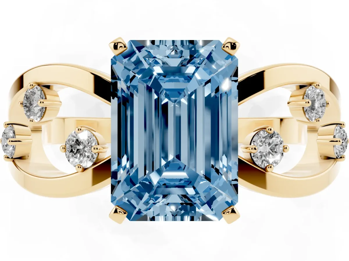 Fancy Blue Emerald Cut Cut Solitaire Diamond with Side Stones on Criss-Cross Band and Four-Prong Setting Yellow gold