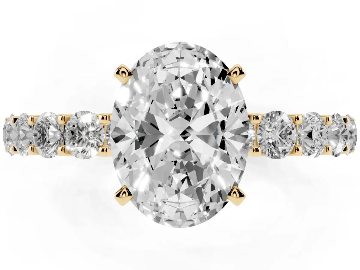 Oval Cut Diamond Solitaire Ring with Shared Prong Pavé Band and Four-Prong Setting Yellow gold