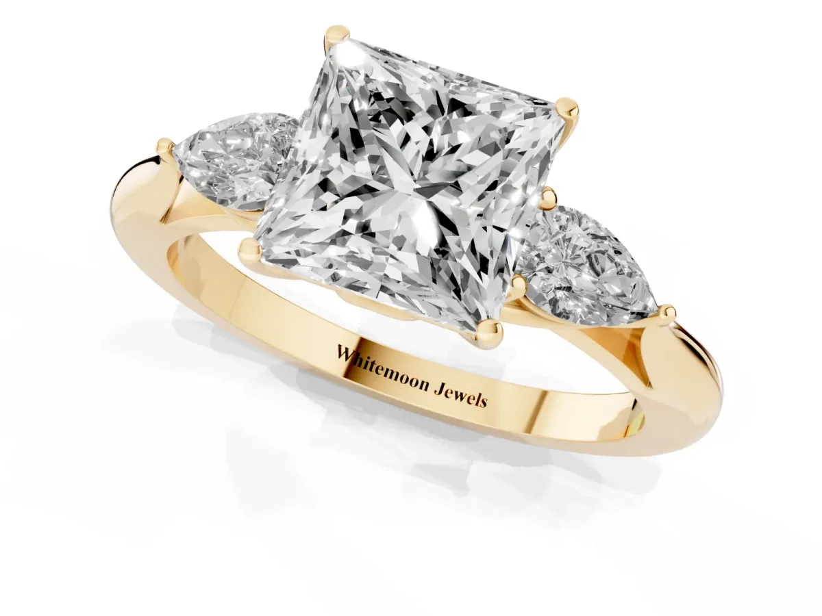 Princess Cut Diamond Three-Stone Ring with Pear Side Stones and Prong Setting Yellow gold