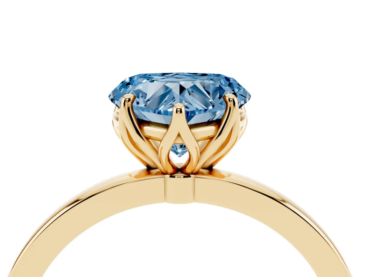Fancy Blue Heart Cut Diamond Solitaire Ring with Thin Band and Prong Setting Yellow gold