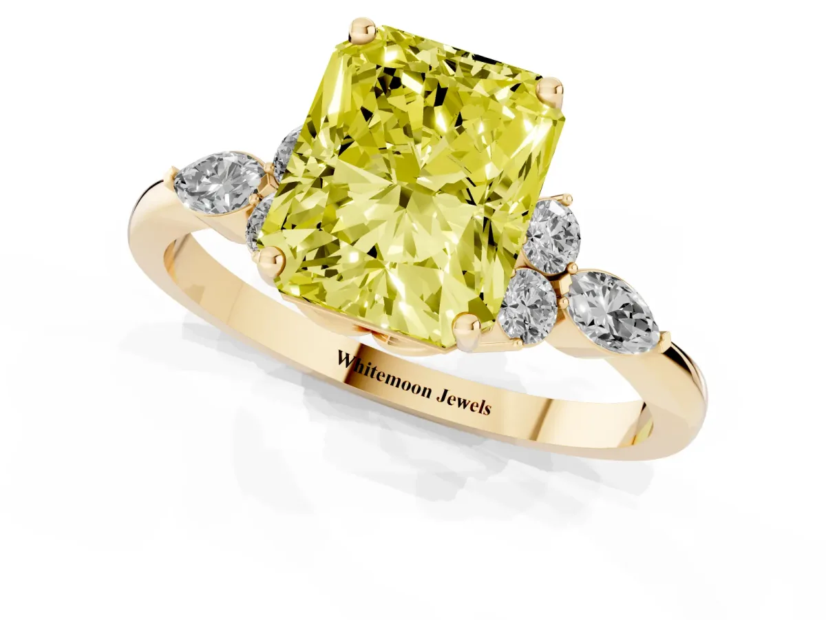 Fancy Yellow Radiant Cut Brilliant Diamond Solitaire Ring with Pear Side Stones and Four-Prong Setting Yellow gold
